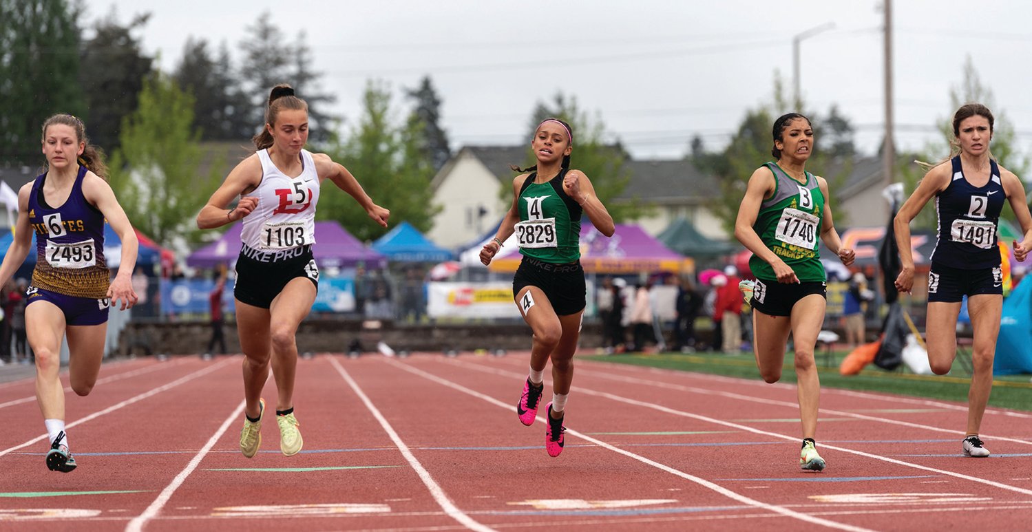 Tumwater's Ava Jones, center, sprints to the finish in the 2A Girls 100 at the 4A/3A/2A State Track and Field Championships on Saturday, May 28, 2022, at Mount Tahoma High School in Tacoma. (Joshua Hart/For The Chronicle)